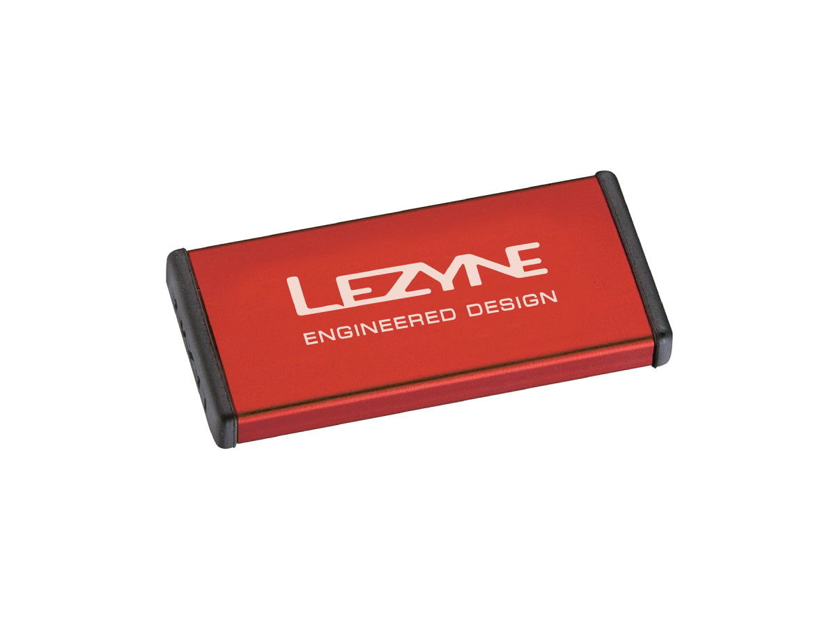 "Lezyne Metal Kit Puncture Patches in red case with self-adhesive patches for compact and durable bike tire repair"







